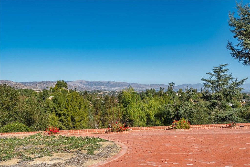 6006 Clear Valley Road Hidden Hills, CA 91302 - Photo 3 of 10 a view of a terrace with a garden