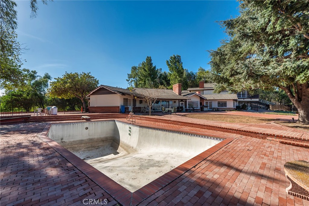 6006 Clear Valley Road Hidden Hills, CA 91302 - Photo 8 of 10 a view of a swimming pool with a patio