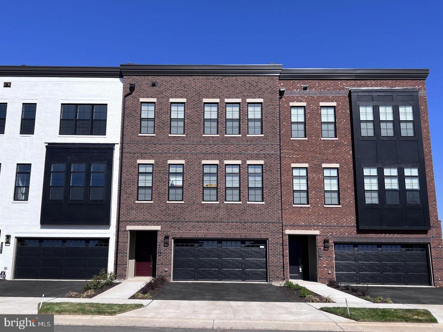 22274 Rivanna Shore Terrace Ashburn, VA 20148 - Photo 1 of 35 Modern townhomes with stylish facades.