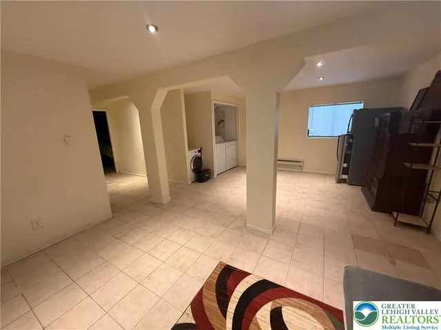 a view of hallway with furniture