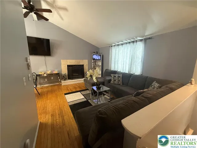 a living room with furniture and a flat screen tv