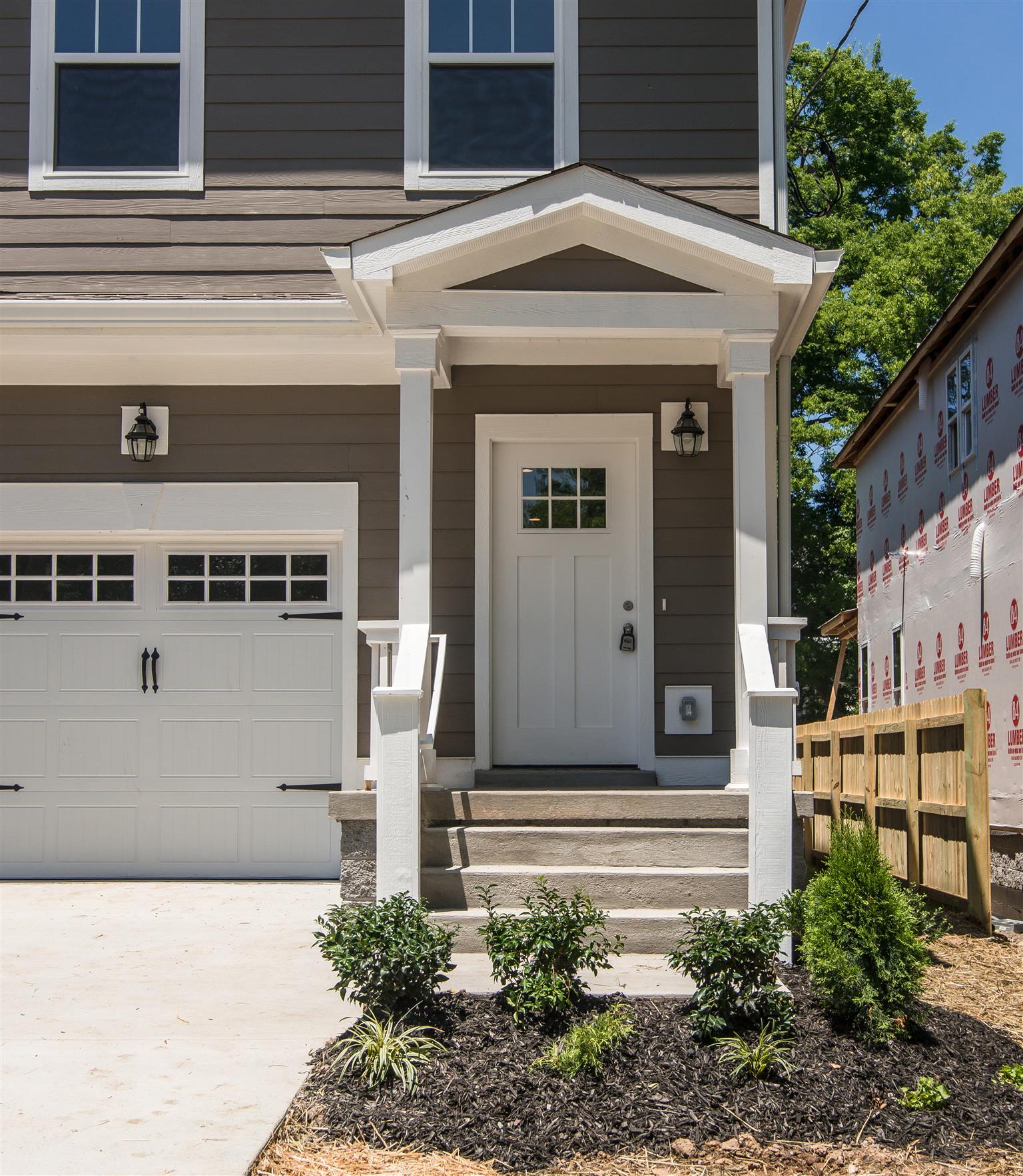 603 B Ries Avenue Nashville, TN 37209 - Photo 2 of 25 a front view of a house with garden
