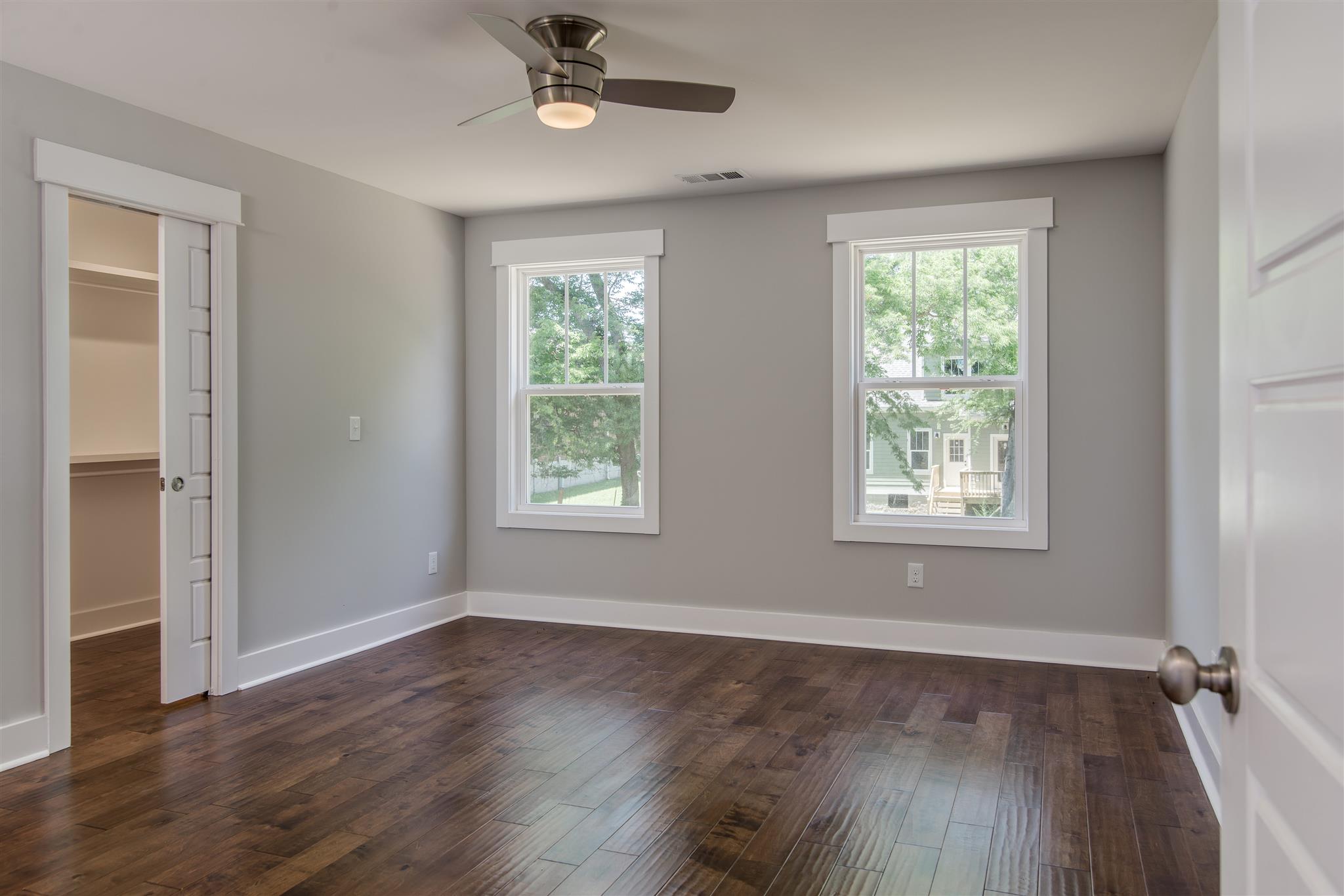 603 B Ries Avenue Nashville, TN 37209 - Photo 12 of 25 a view of an empty room with wooden floor and a window