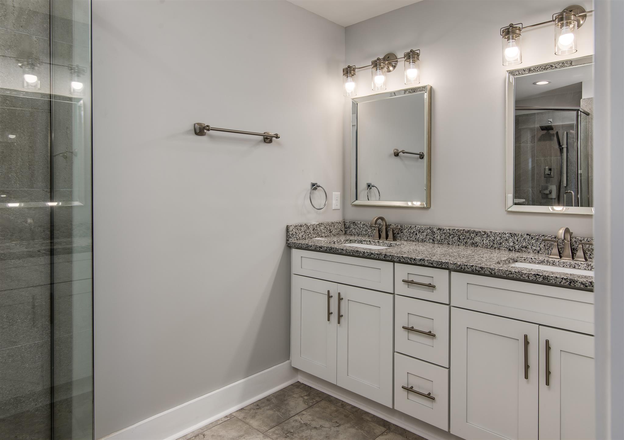 603 B Ries Avenue Nashville, TN 37209 - Photo 14 of 25 a bathroom with a granite countertop sink and a mirror