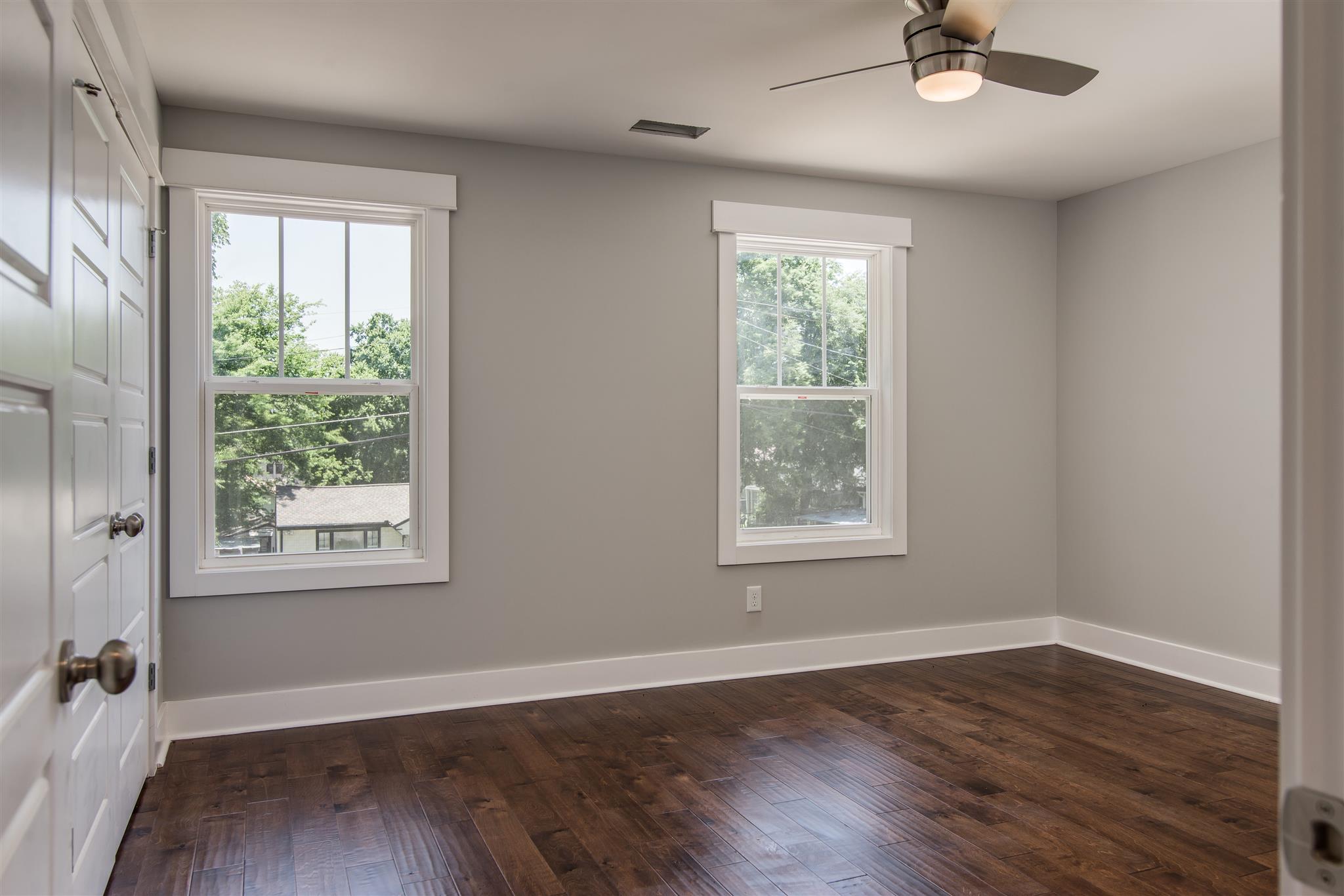 603 B Ries Avenue Nashville, TN 37209 - Photo 17 of 25 a view of an empty room with a window and wooden floor
