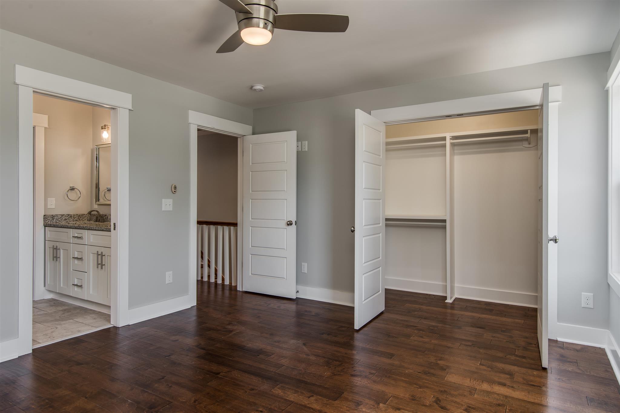 603 B Ries Avenue Nashville, TN 37209 - Photo 18 of 25 an empty room with wooden floor cabinet and windows