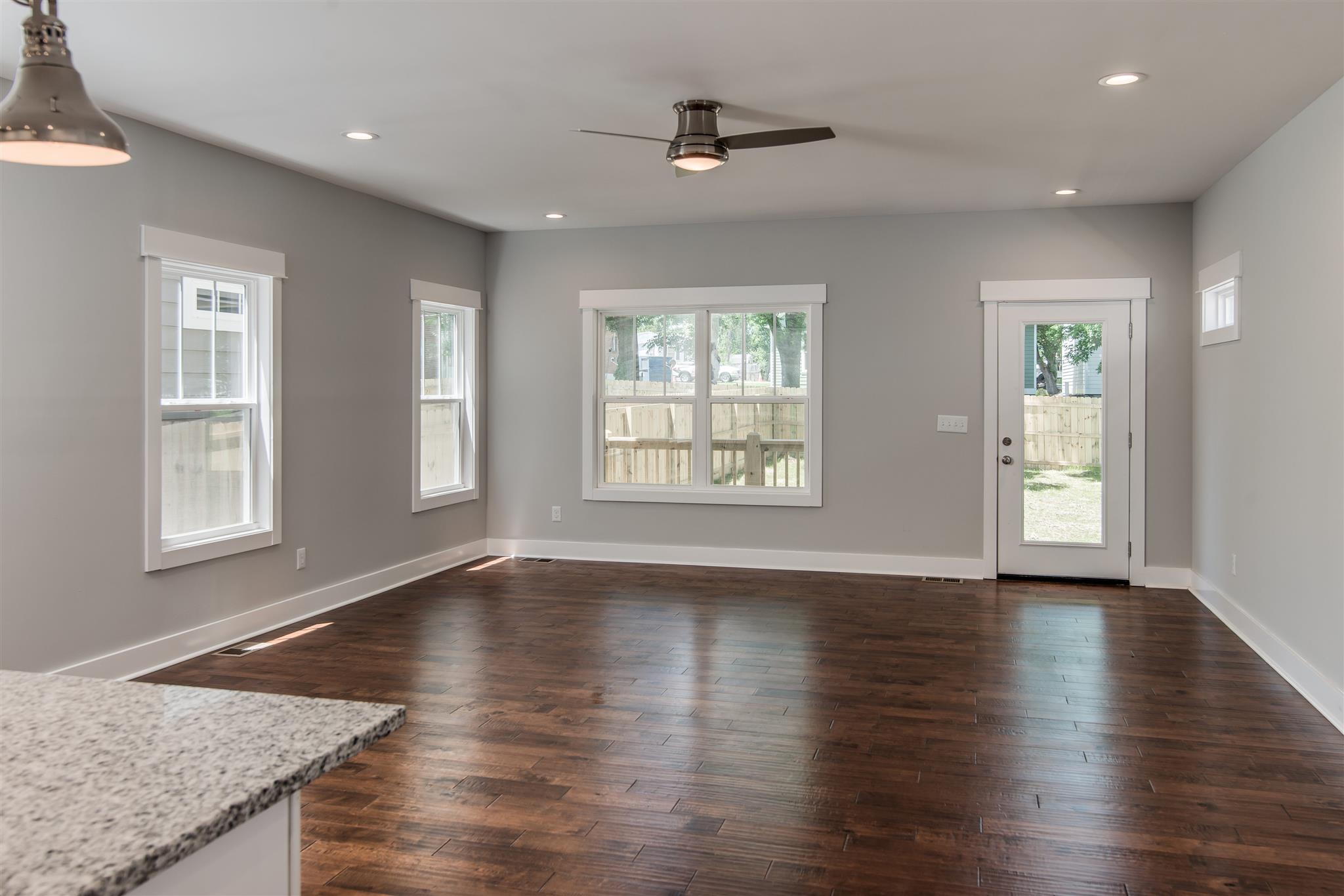 603 B Ries Avenue Nashville, TN 37209 - Photo 5 of 25 an empty room with wooden floor and windows