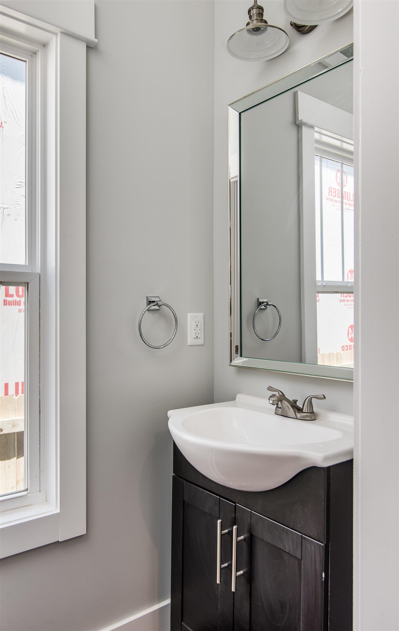 603 B Ries Avenue Nashville, TN 37209 - Photo 10 of 25 a bathroom with a sink and a mirror