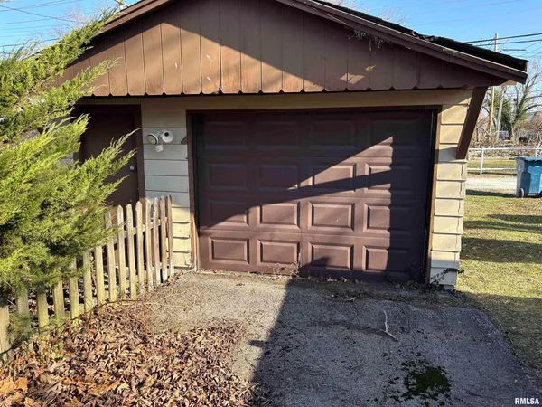 a view of house with backyard and deck
