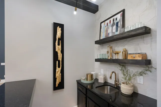 a bathroom with a sink vanity mirror and toilet