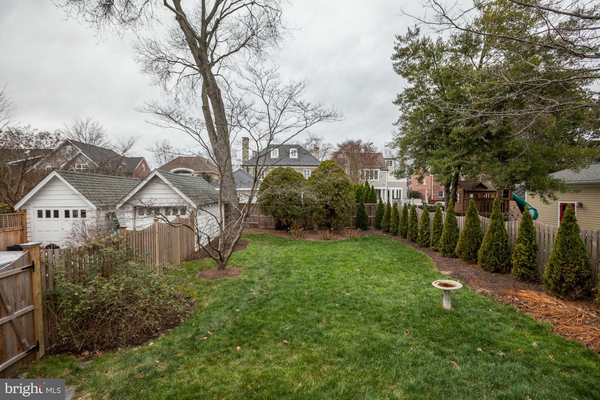 7206 Denton Road Bethesda, MD 20814 - Photo 22 of 24 a view of a large garden with plants and large trees