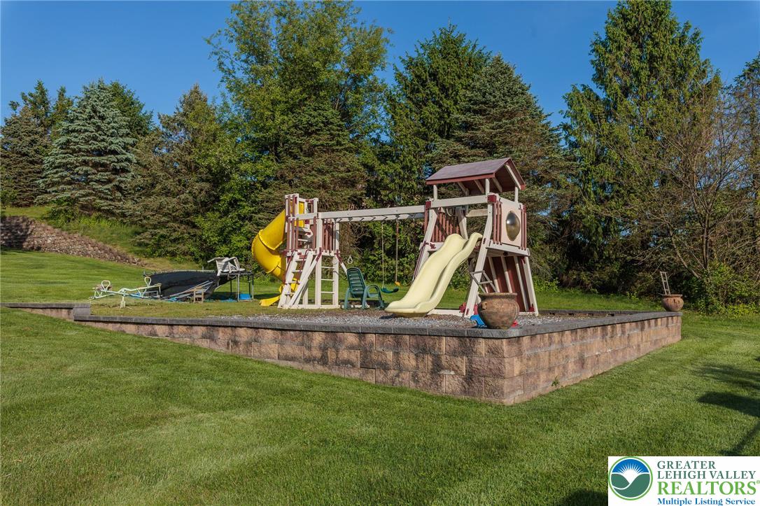 2170 Clearview Road Coplay, PA 18037 - Photo 68 of 75 This spacious yard features a vibrant playground, perfect for endless outdoor enjoyment.