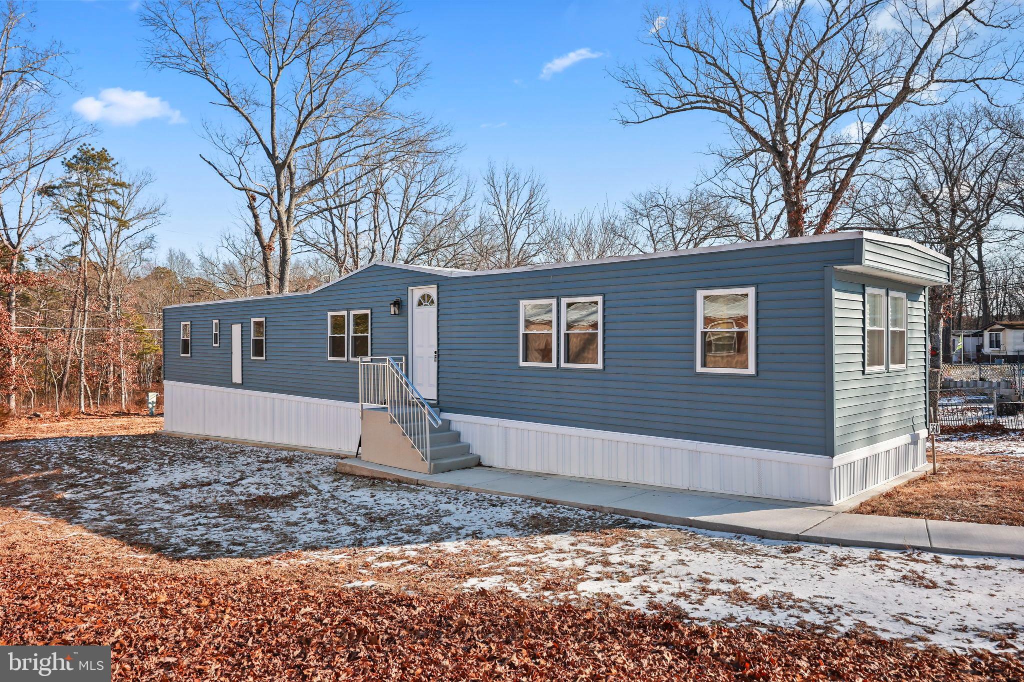3610 Weymouth Road, Unit A Browns Mills, NJ 08015 - Photo 2 of 28 Charming blue home nestled in nature's embrace.
