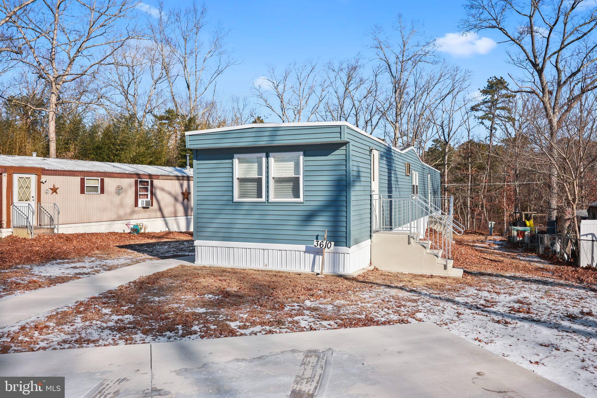 3610 Weymouth Road, Unit A Browns Mills, NJ 08015 - Photo 5 of 28 Charming blue home nestled among trees.