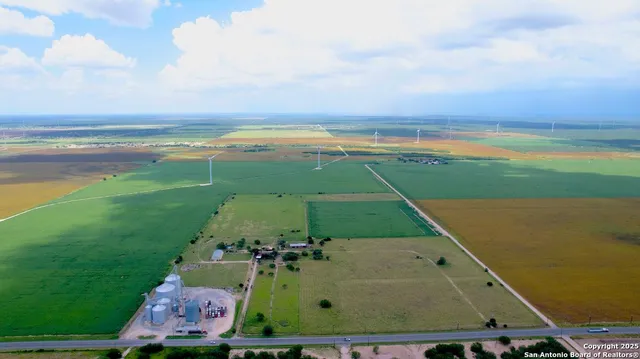 an aerial view of a houses with outdoor space