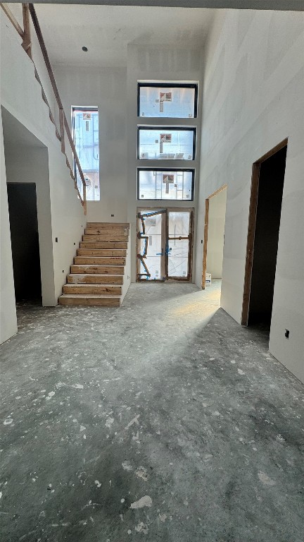 65 Shadow Creek Ridge Drive Spring, TX 77389 - Photo 23 of 35 a view of an empty room with wooden floor and stairs