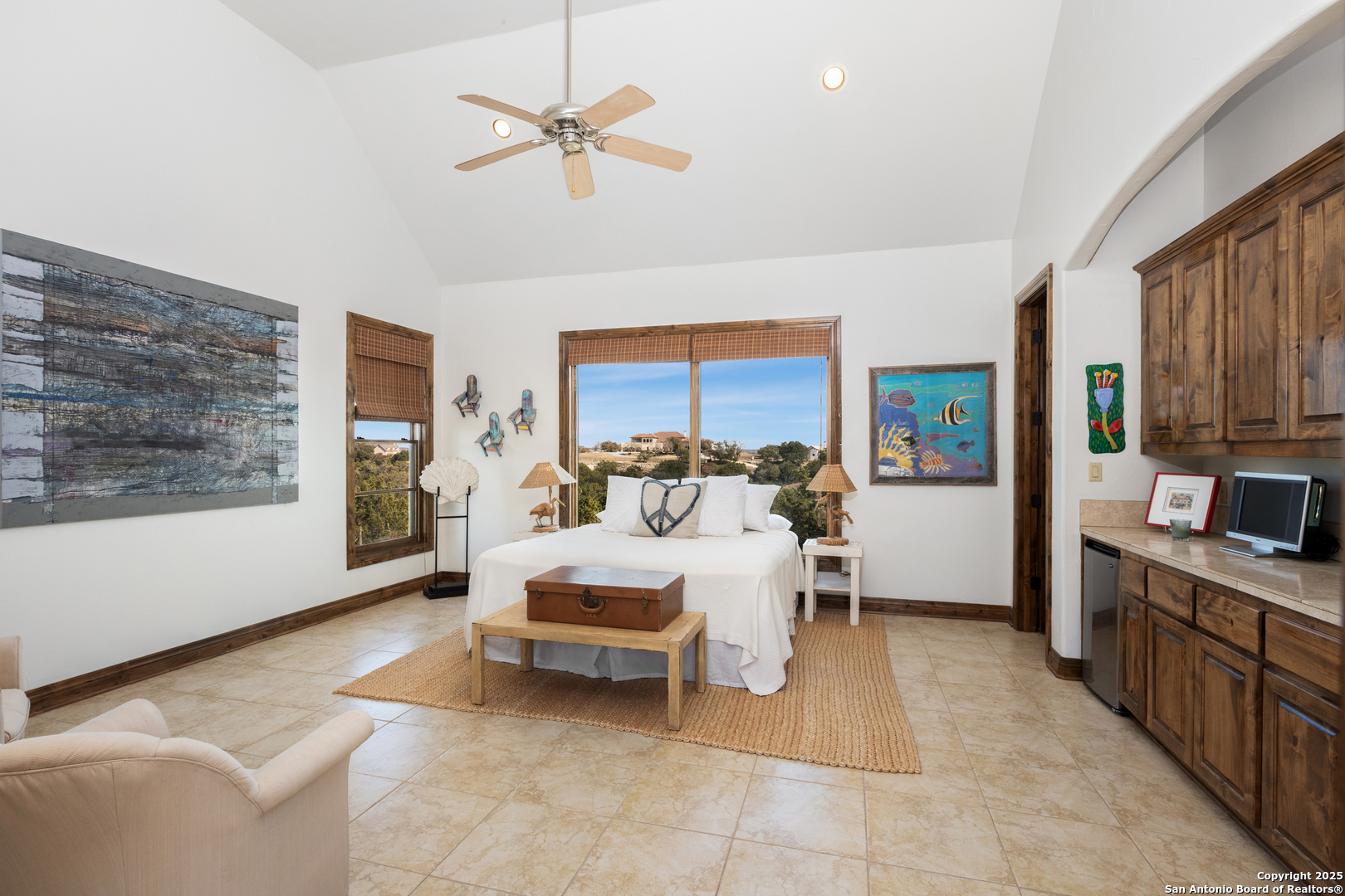 165 Painted Sky Comfort, TX 78013 - Photo 17 of 49 a bed room with a bed furniture and a large window
