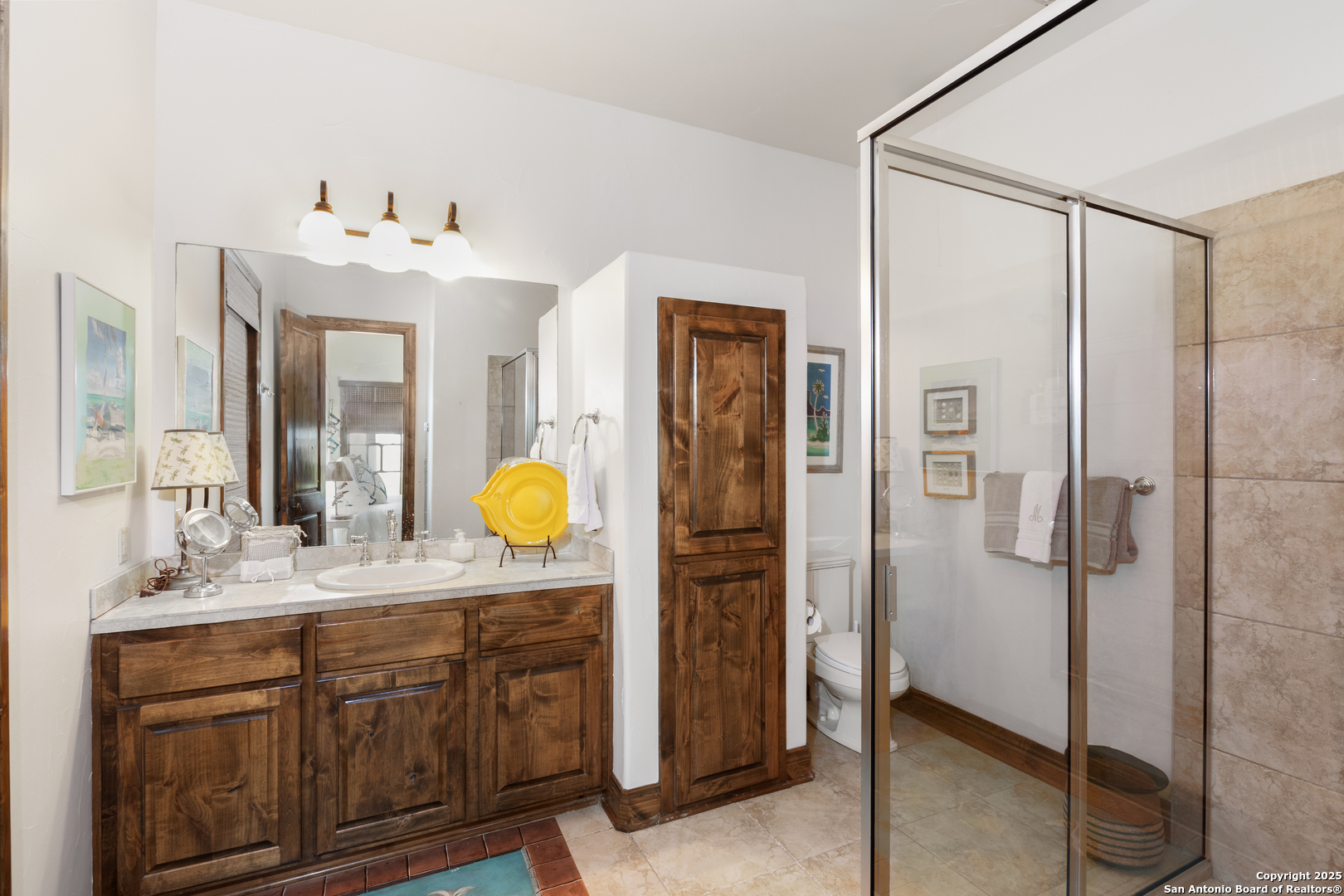 165 Painted Sky Comfort, TX 78013 - Photo 18 of 49 a bathroom with a granite countertop sink mirror and a shower