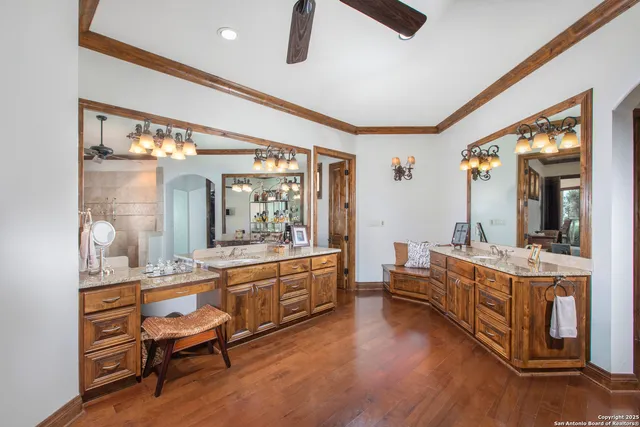 a living room with fireplace furniture and a potted plant