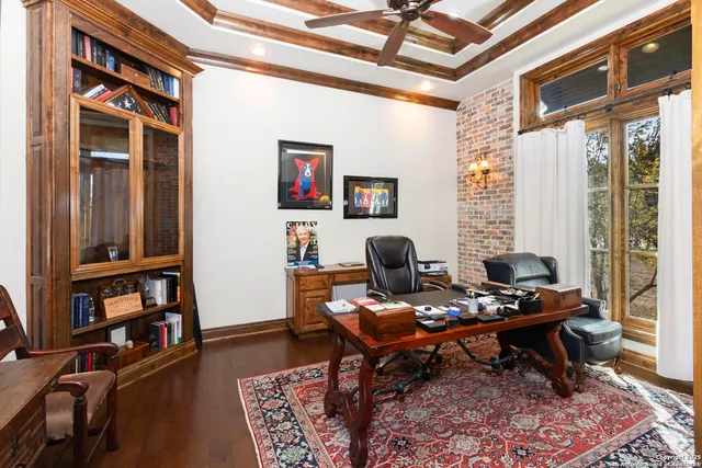 a kitchen with stainless steel appliances kitchen island granite countertop a table and chairs in it
