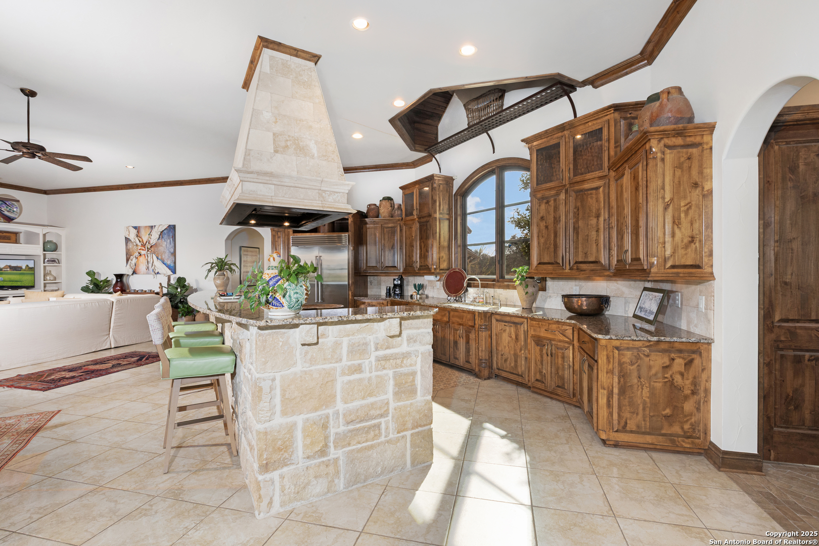 165 Painted Sky Comfort, TX 78013 - Photo 31 of 49 a kitchen with stainless steel appliances kitchen island granite countertop a table and chairs in it