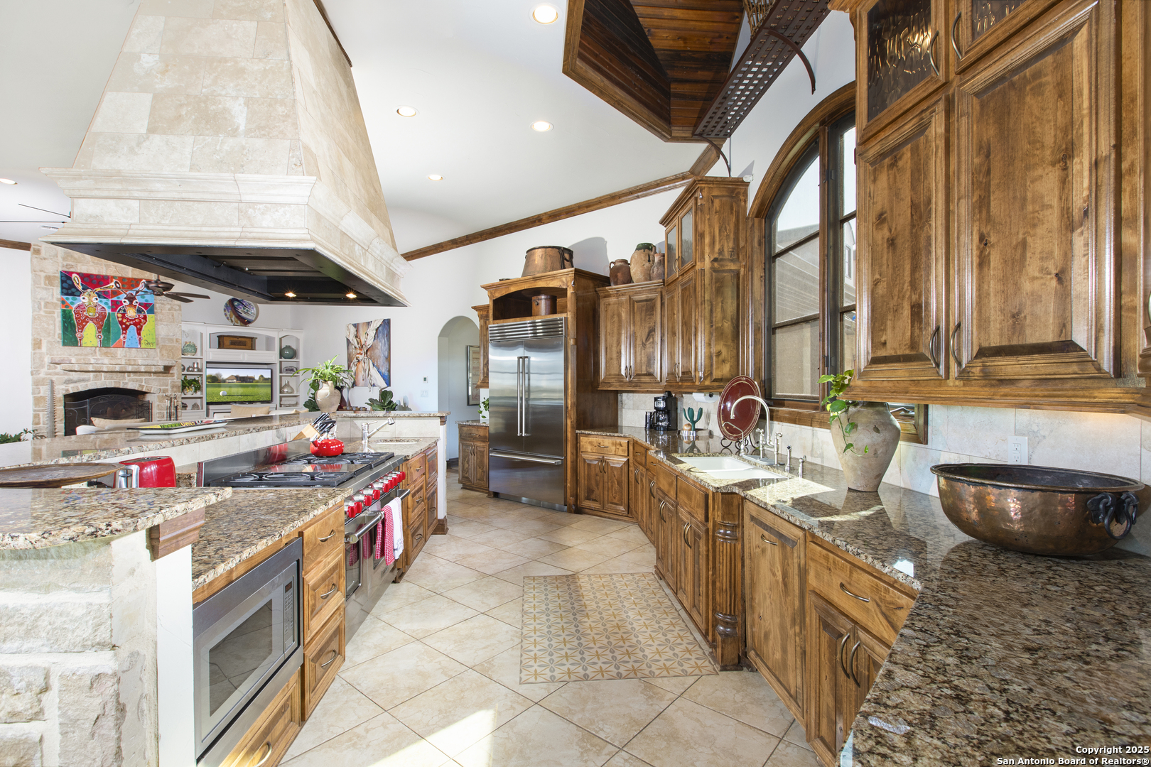 165 Painted Sky Comfort, TX 78013 - Photo 32 of 49 a storage utility room with stainless steel appliances kitchen island granite countertop a sink and cabinets