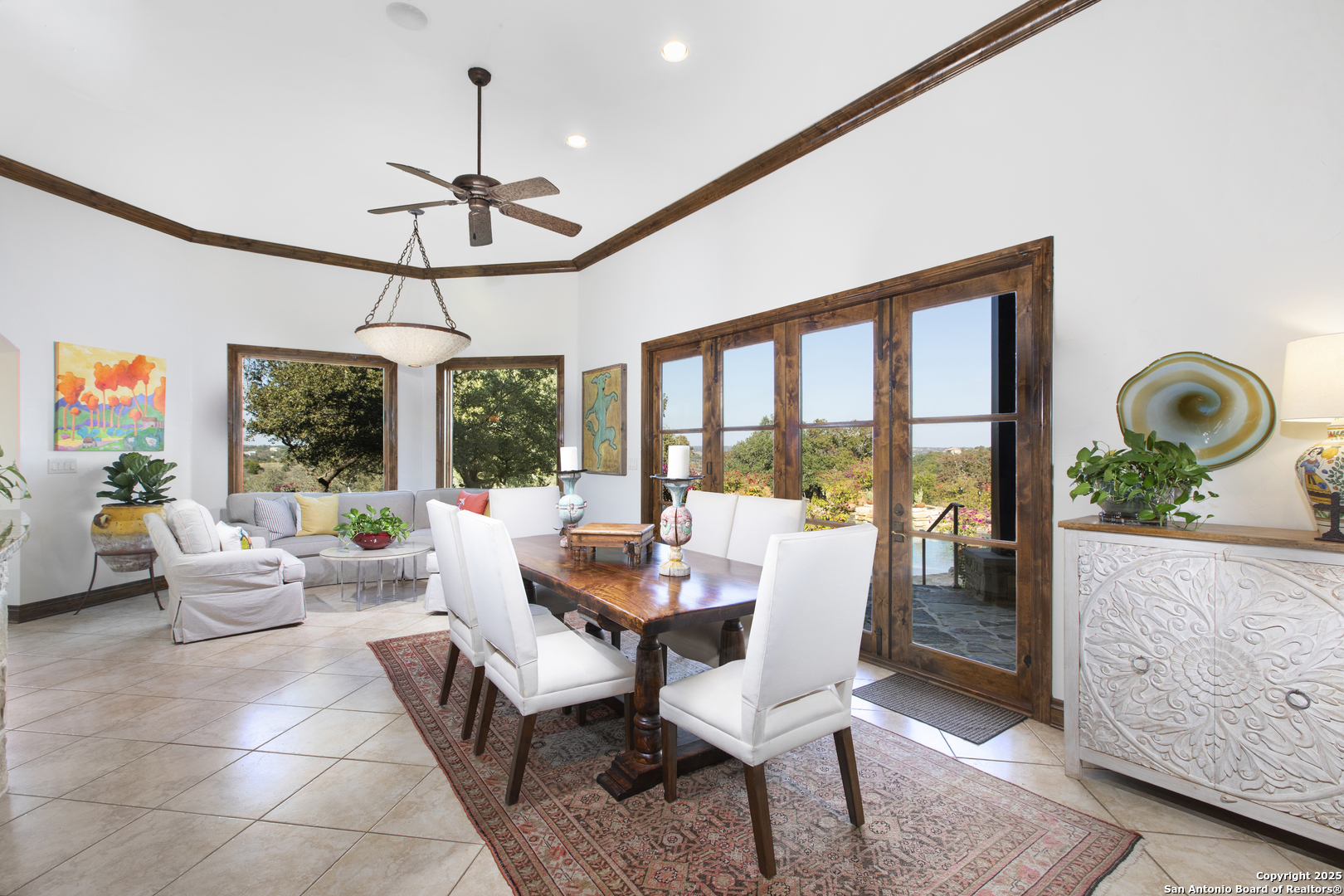 165 Painted Sky Comfort, TX 78013 - Photo 34 of 49 a dining room with furniture a chandelier and a rug