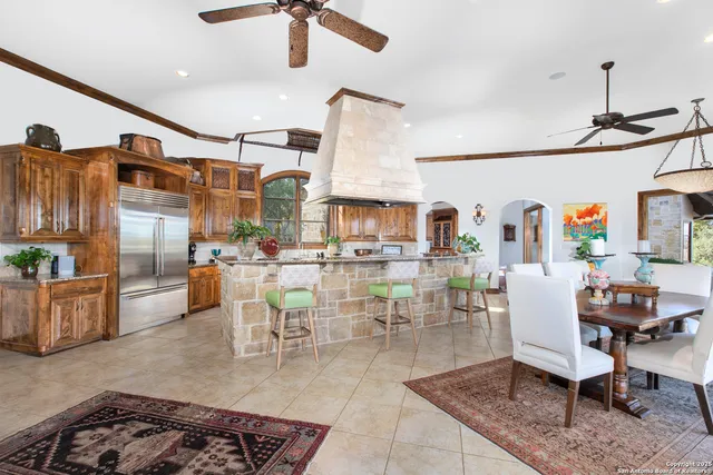 a room with furniture and a ceiling fan