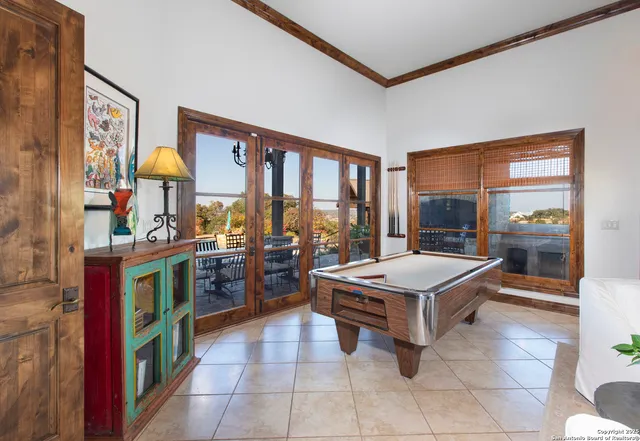 a room with furniture and a flat screen tv