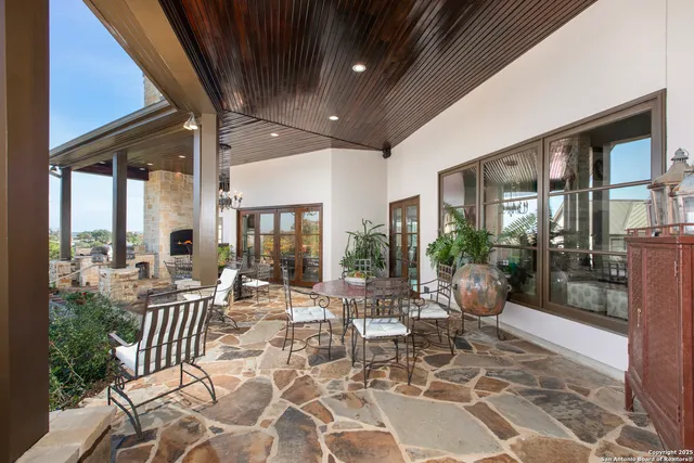 a outdoor space with lots of tables a garden view and chairs