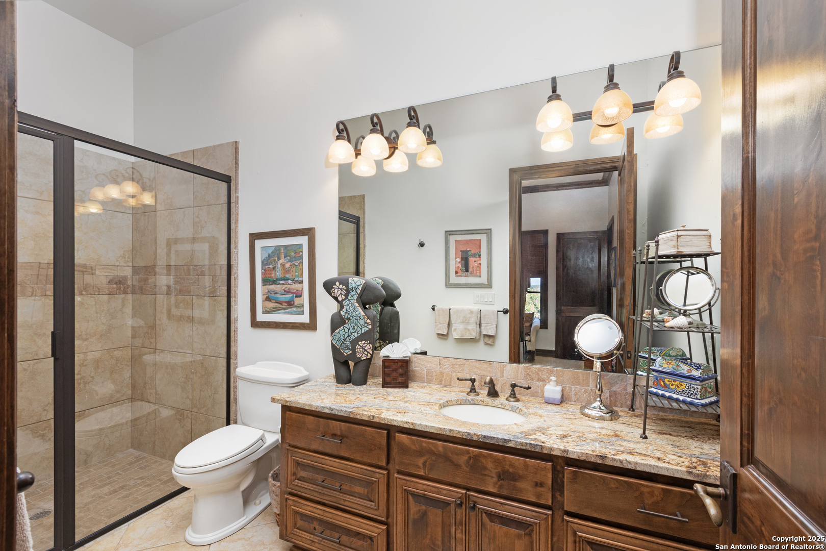 165 Painted Sky Comfort, TX 78013 - Photo 45 of 49 a bathroom with a toilet sink and mirror