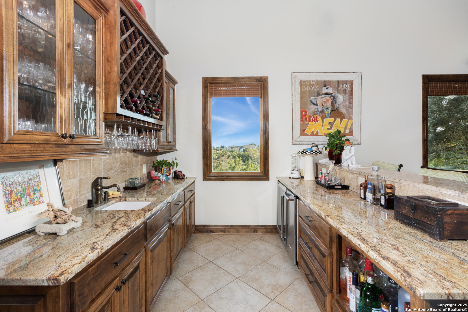 165 Painted Sky Comfort, TX 78013 - Photo 47 of 49 a kitchen that has a lot of cabinets in it