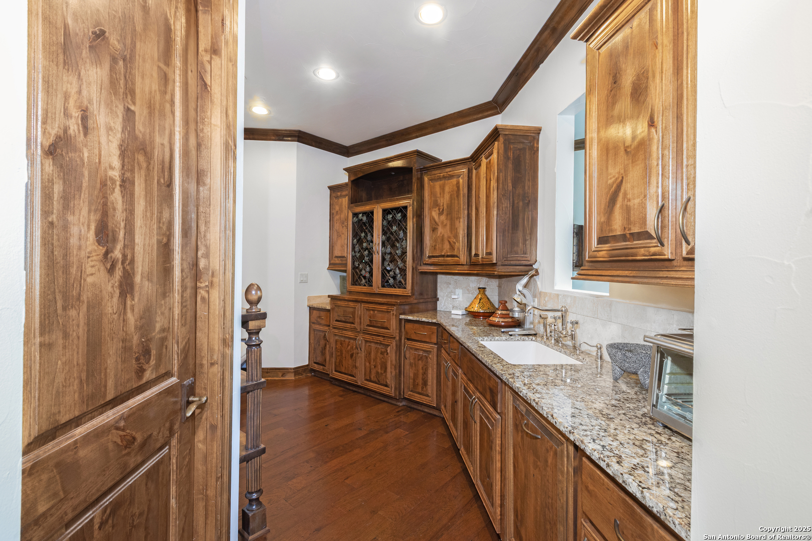 165 Painted Sky Comfort, TX 78013 - Photo 48 of 49 a bathroom with a granite countertop sink a mirror and a bathtub