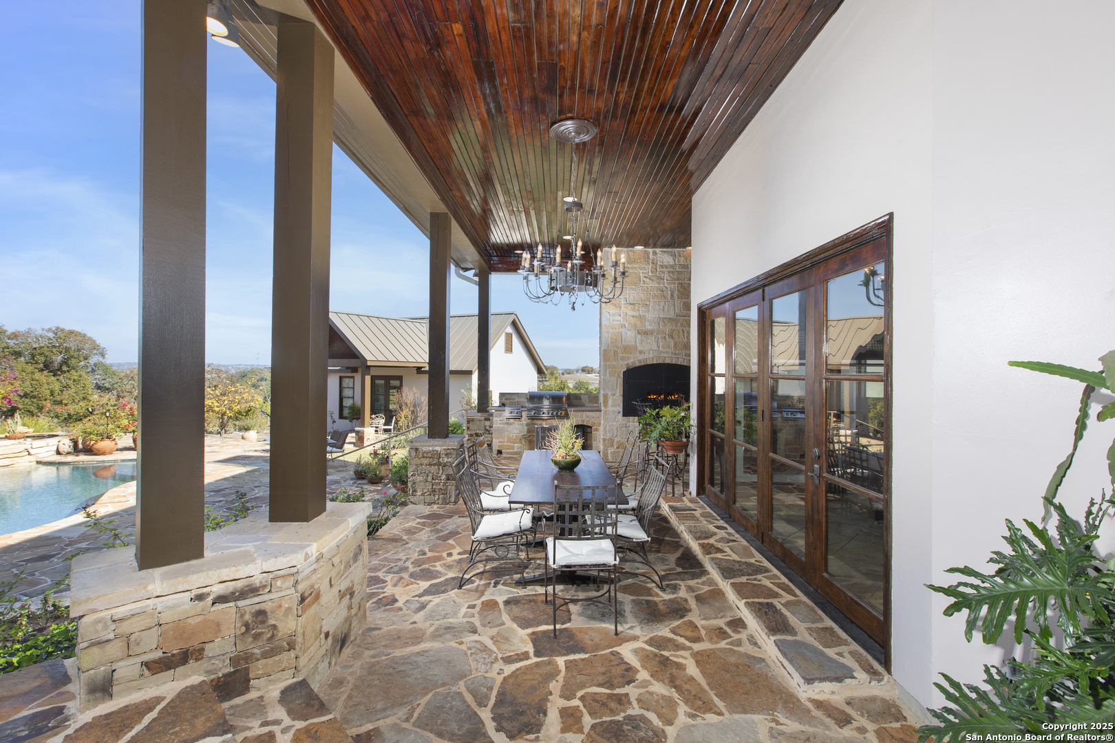 165 Painted Sky Comfort, TX 78013 - Photo 5 of 49 a view of a patio with chair and tables back yard of the house
