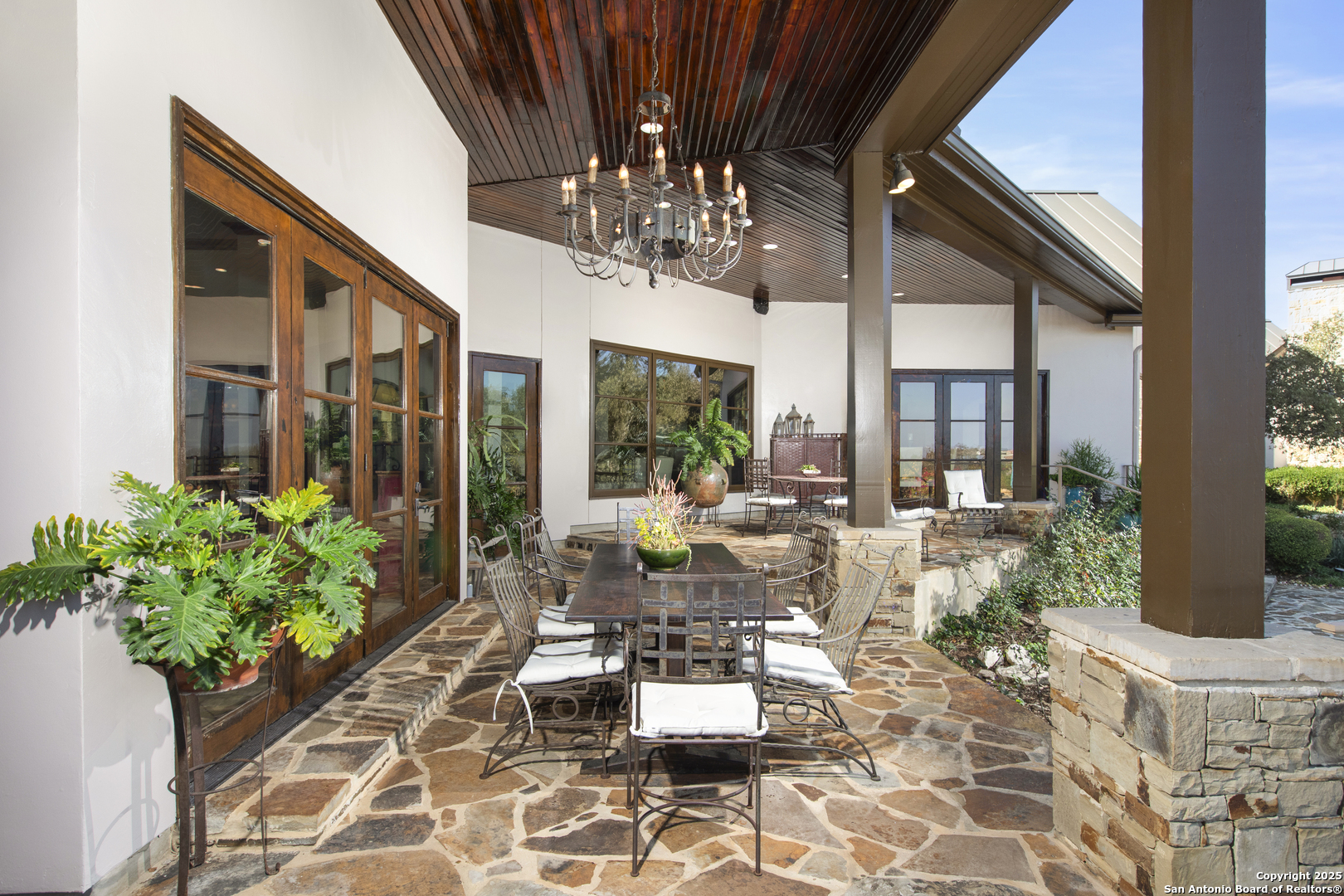 165 Painted Sky Comfort, TX 78013 - Photo 7 of 49 a building outdoor space with patio furniture and potted plants