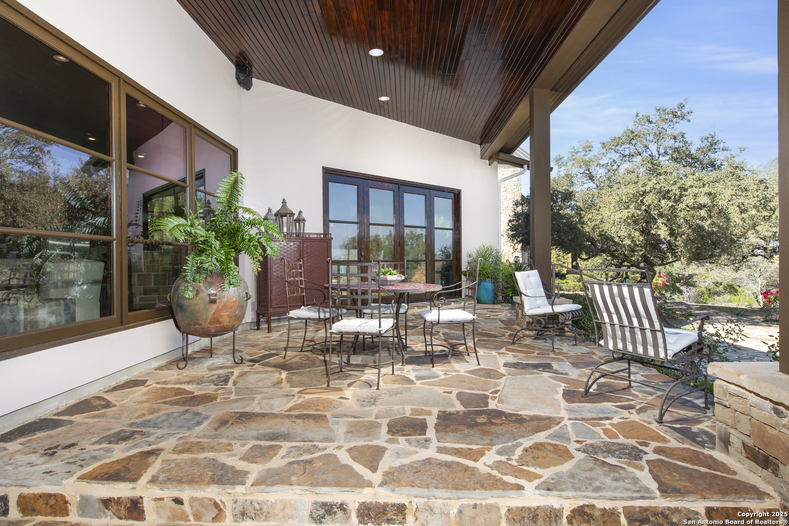 165 Painted Sky Comfort, TX 78013 - Photo 8 of 49 a view of a porch with chairs and potted plants