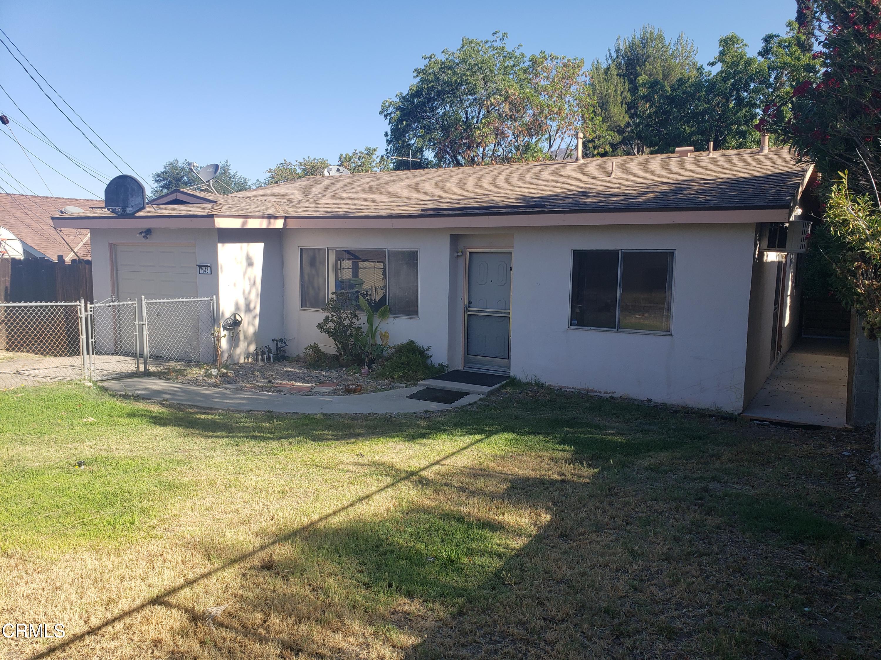 7143 Hillrose Street Tujunga, CA 91042 - Photo 2 of 13 a view of a house with pool and a yard