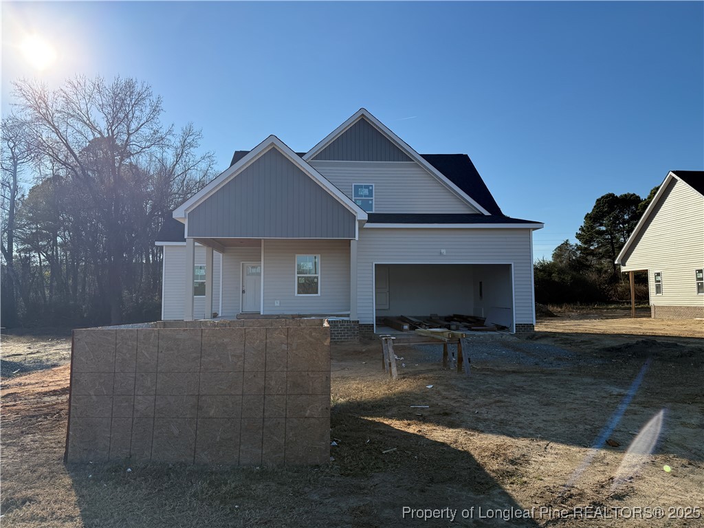 3205 Leaflet Church Road Broadway, NC 27505 - Photo 1 of 12 a front view of a house with seating space