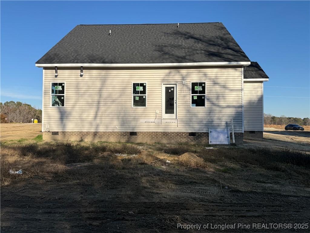 3205 Leaflet Church Road Broadway, NC 27505 - Photo 12 of 12 a front view of a house with yard