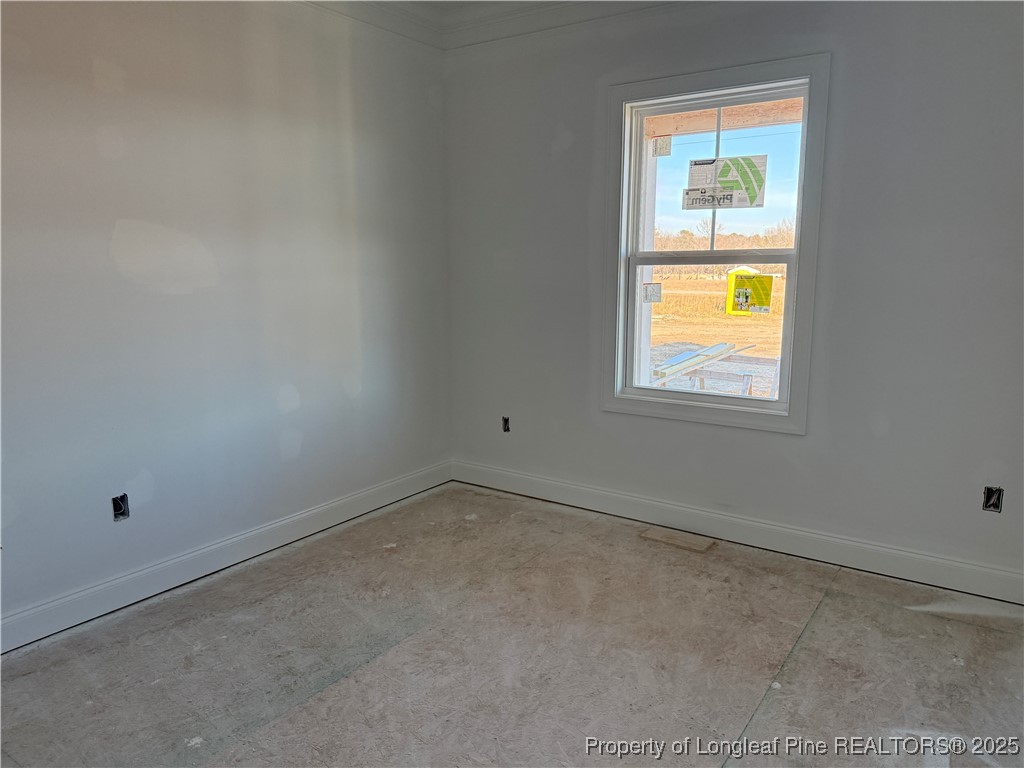 3205 Leaflet Church Road Broadway, NC 27505 - Photo 2 of 12 a view of an empty room with a window