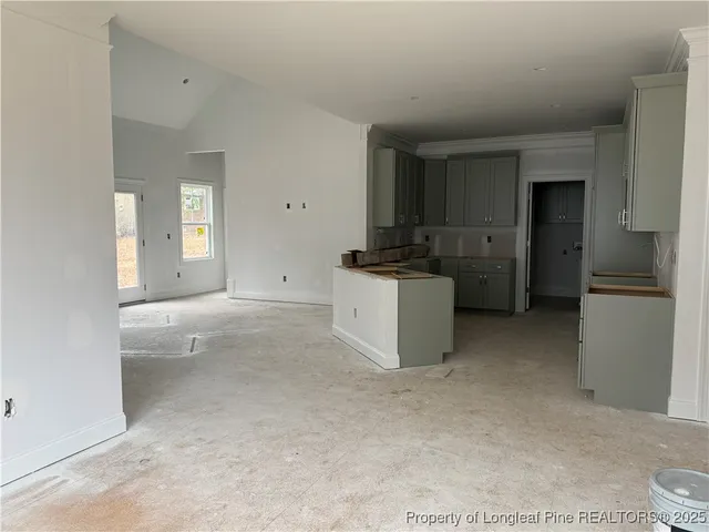 a room with a stove and a refrigerator