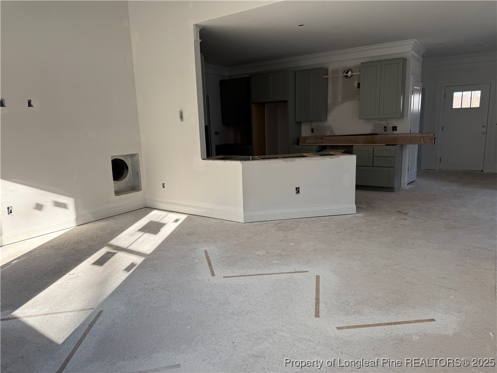 3205 Leaflet Church Road Broadway, NC 27505 - Photo 5 of 12 a kitchen with a stove and white cabinets