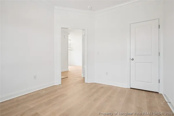 an empty room with wooden floor