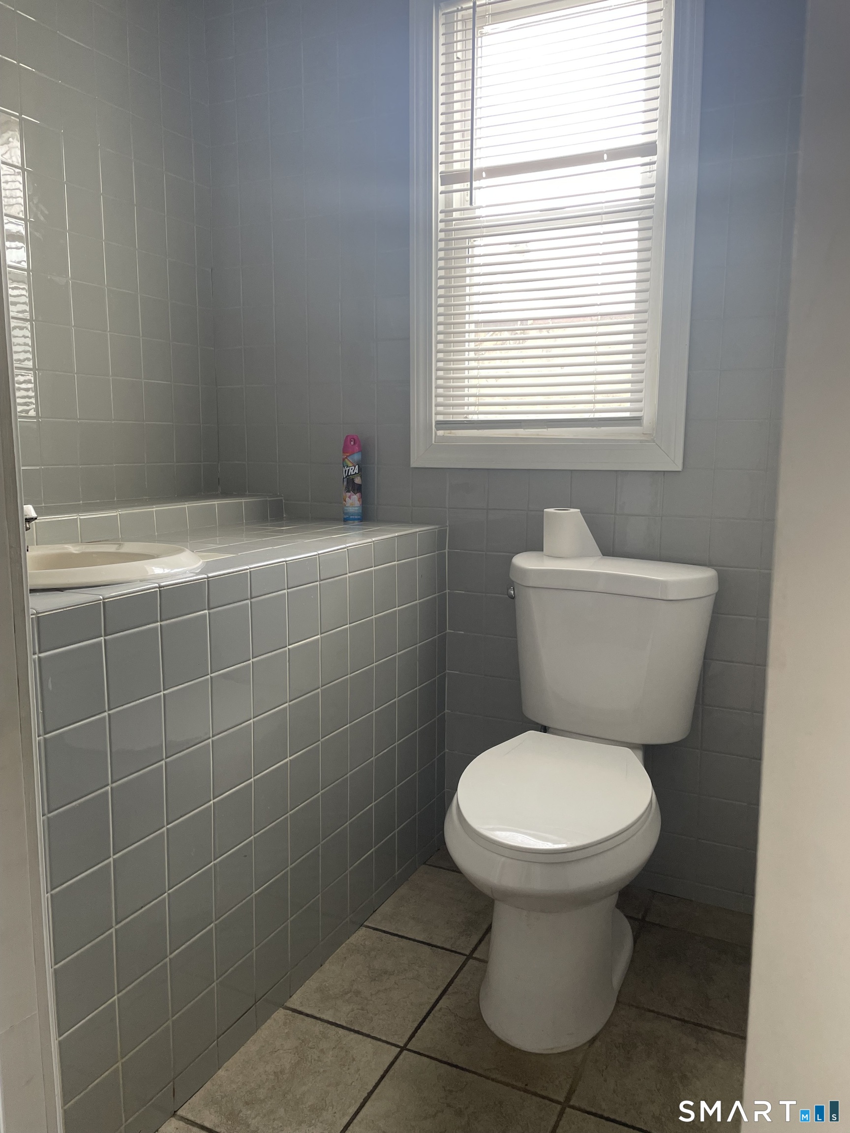 227 Arctic Street Bridgeport, CT 06608 - Photo 12 of 19 a bathroom with a toilet and a shower
