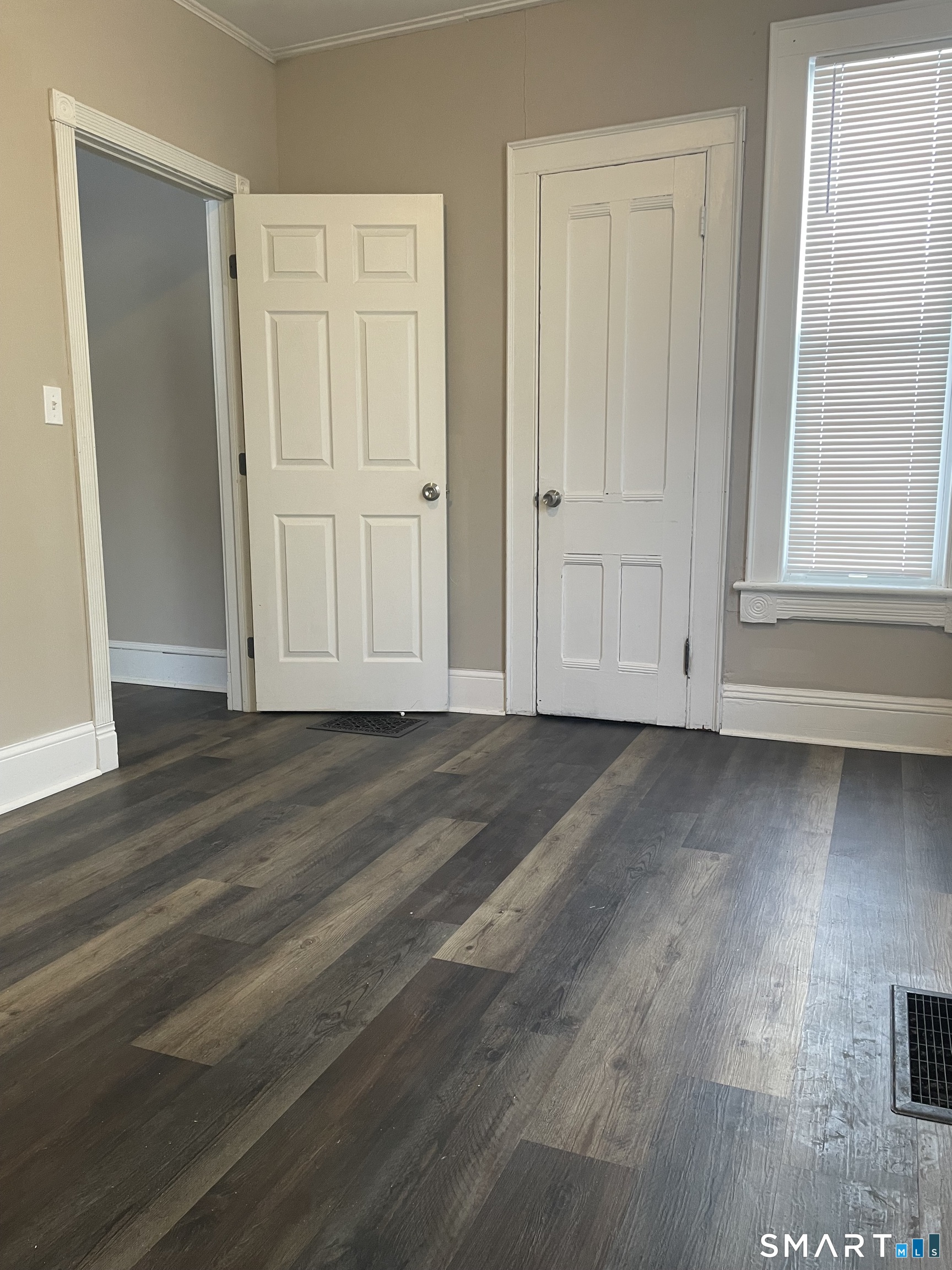 227 Arctic Street Bridgeport, CT 06608 - Photo 9 of 19 an empty room with wooden floor