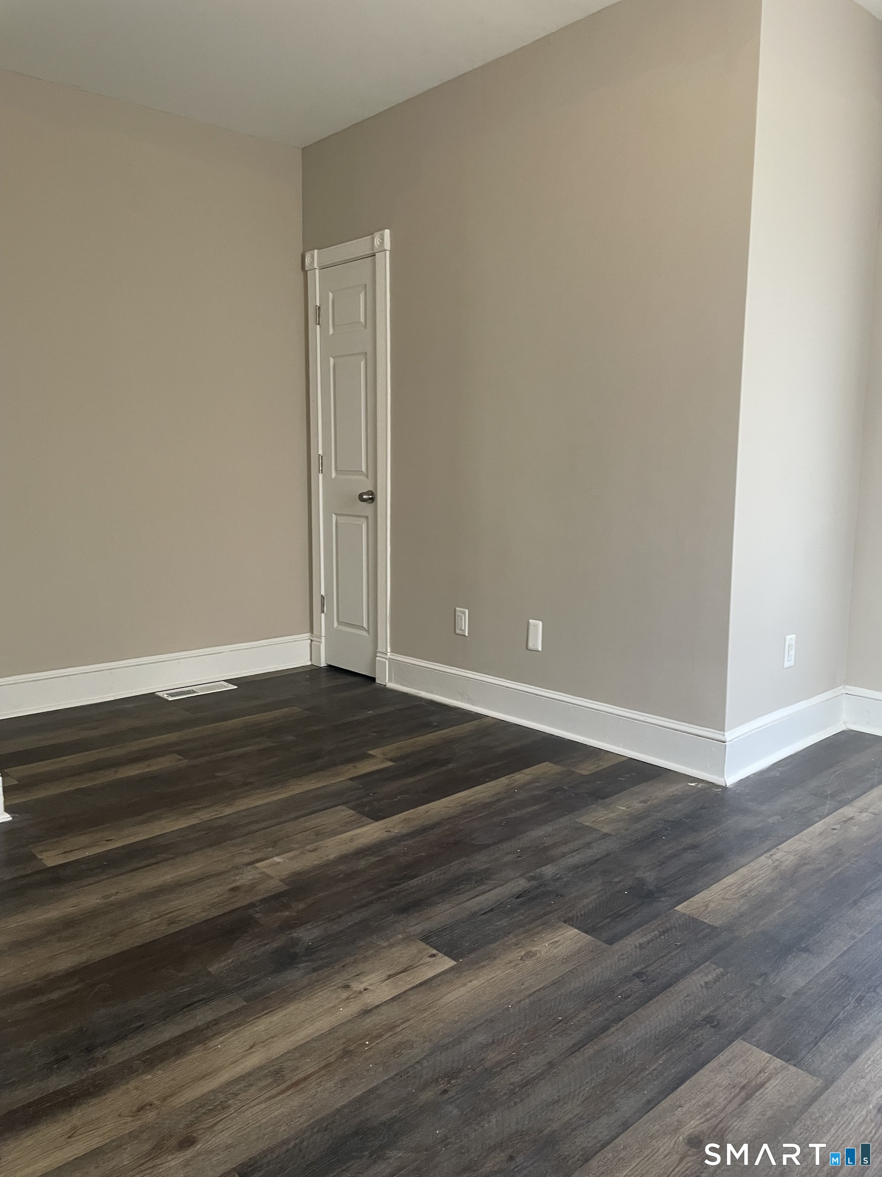 227 Arctic Street Bridgeport, CT 06608 - Photo 10 of 19 a view of empty room with wooden floor