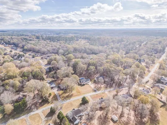 a bathroom with a granite countertop sink a large mirror and a