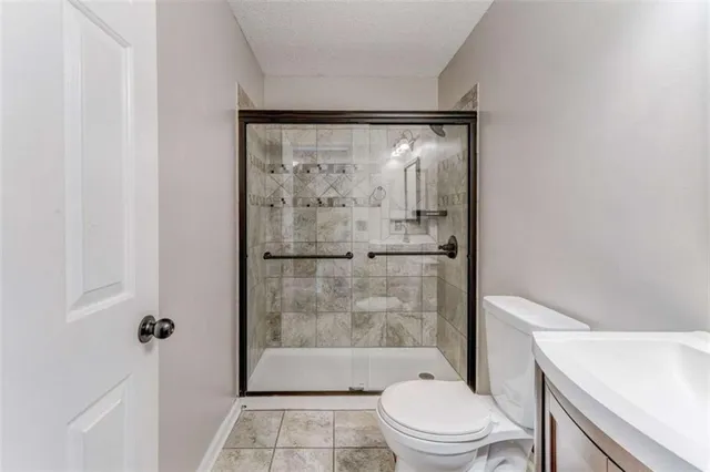 a view of a kitchen with wooden floor and a window