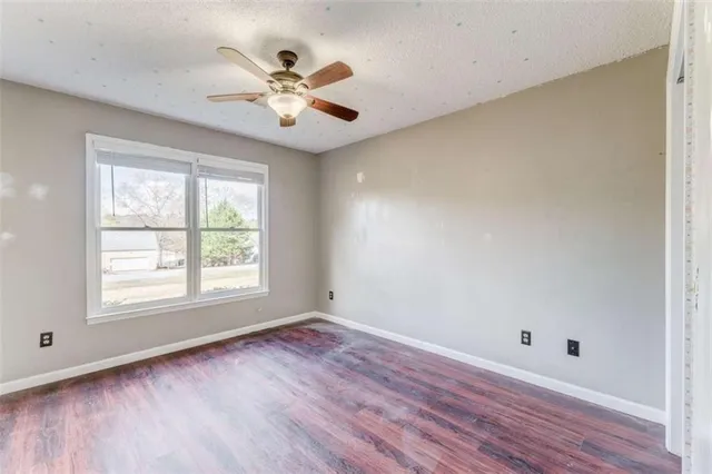 a view of kitchen with granite countertop cabinets and wooden floor