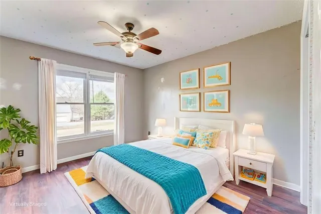 a view of empty room with wooden floor and window